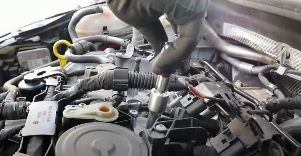 hand tighten spark plugs first