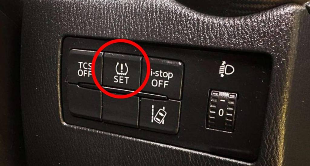 mazda tpms light reset location close-up