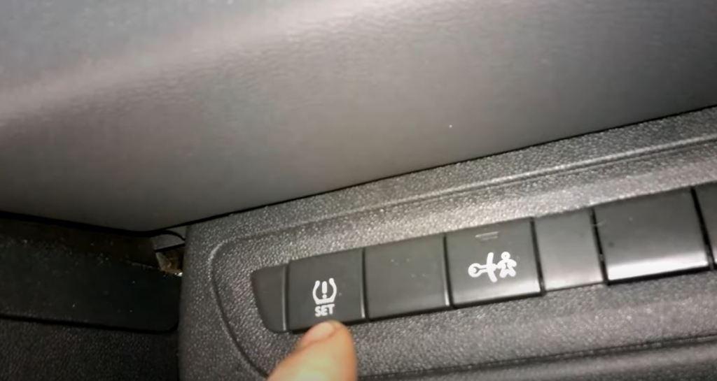 tyre pressure reset button on a peugeot 208