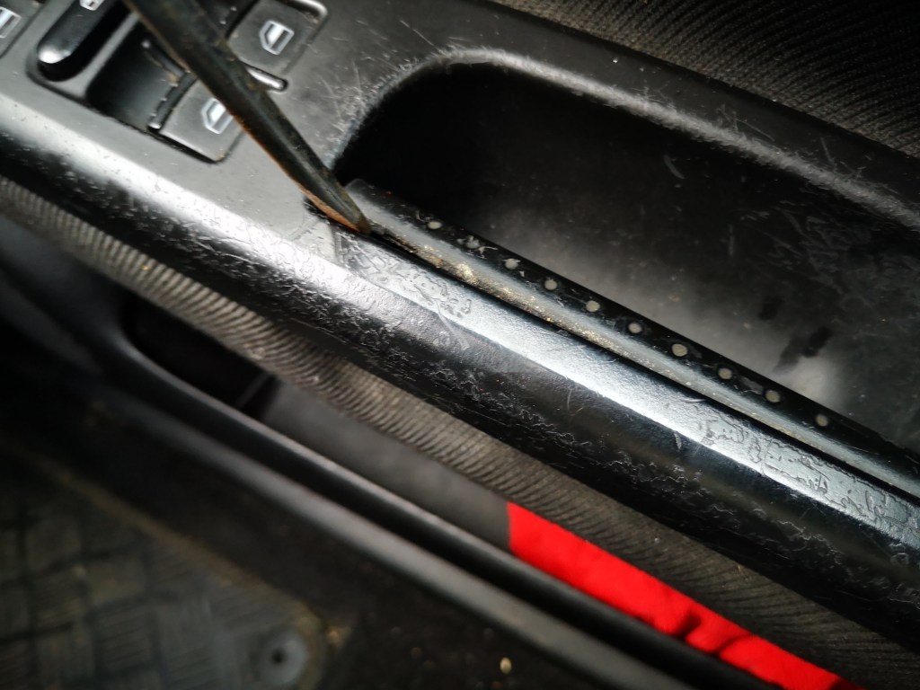 removing grab handle with flat head screwdriver on mk4 golf