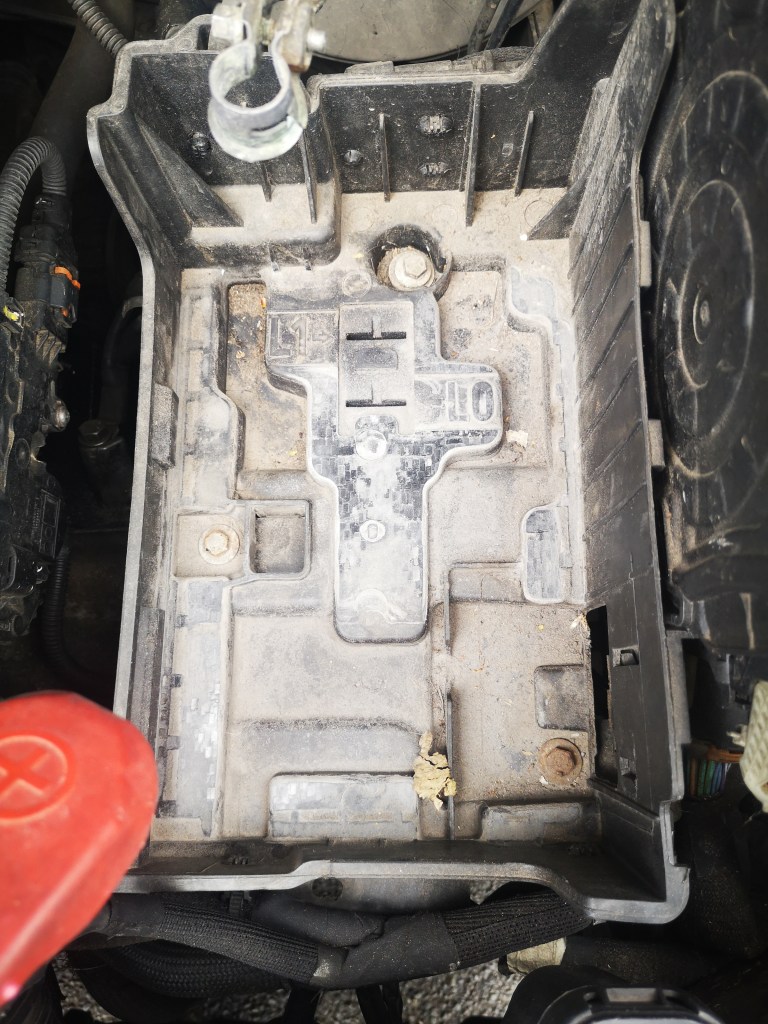 peugeot 208 2015 battery tray in the engine bay